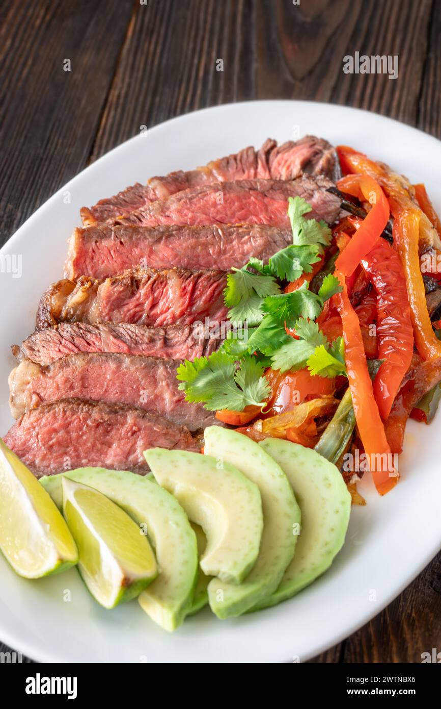 Mexican beef steak fajitas on the plate Stock Photo