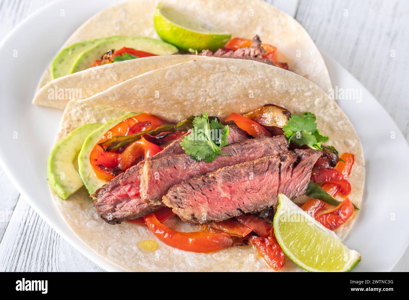 Mexican beef steak fajitas on the plate Stock Photo