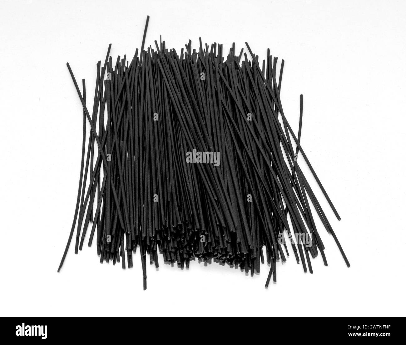 Healthy raw black rice noodles on white background Stock Photo - Alamy