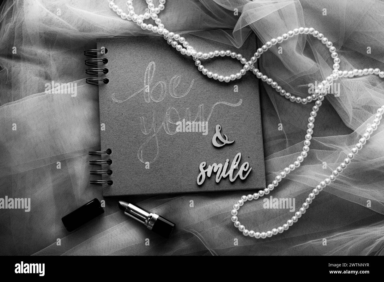 notepad with message and pearls Stock Photo