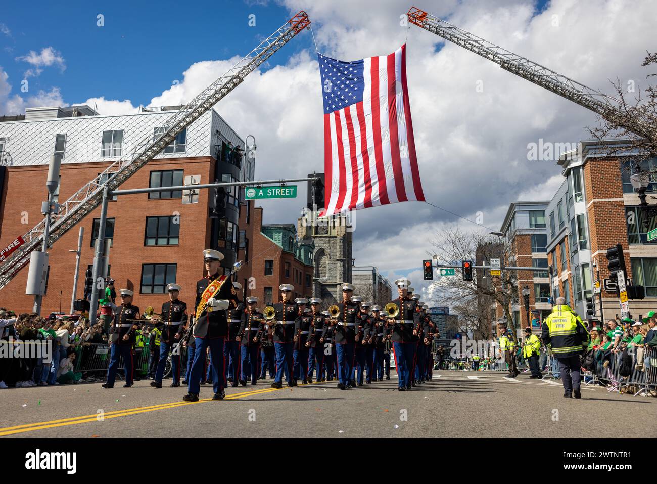 U.S. Marines with the Quantico Marine Corps Band perform at the South Boston St. Patrick’s Day Parade in Boston, Massachusetts, March 17, 2024. The Quantico Marine Corps Band provides musical support that fosters positive community relations, enhances troop morale, and promotes the Marine Corps recruiting program through events such as parades, concerts, and ceremonies. (U.S. Marine Corps photo by Lance Cpl. Joaquin Dela Torre) Stock Photo