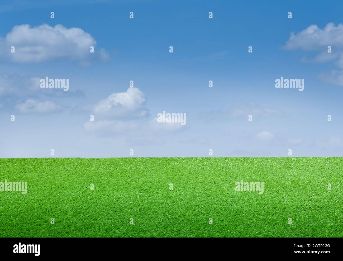 Green grass under blue sky with clouds Stock Photo - Alamy