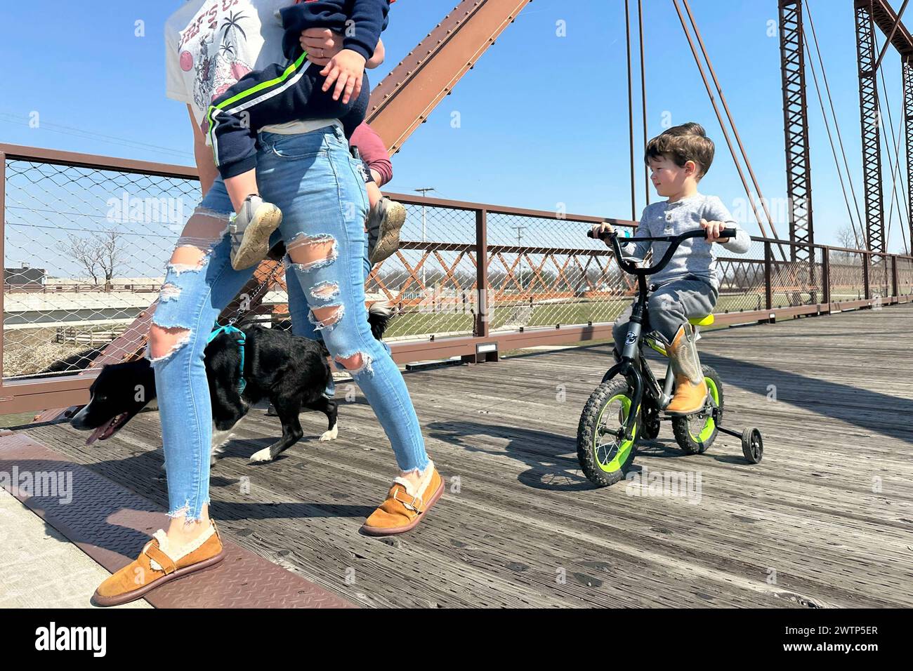 Fouryear old Maxton Mercer, far right, rides his tricycle across the
