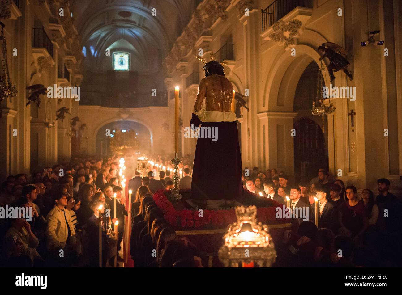 Malaga, Spain. 18th Mar, 2024. The statue of Christ is being carried by ...