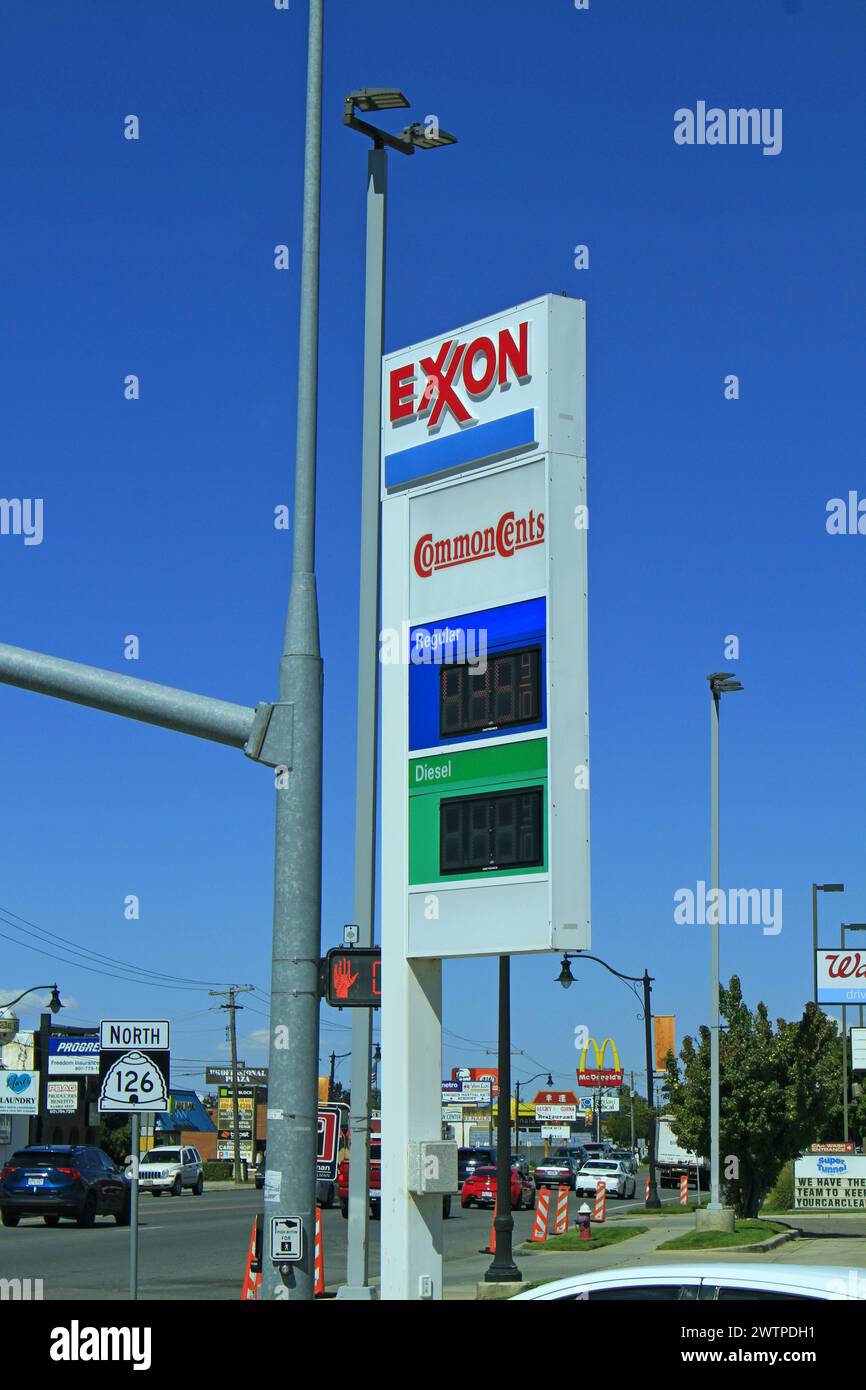 EXXON Gas station advertisement sign with blue sky outdoor Stock Photo