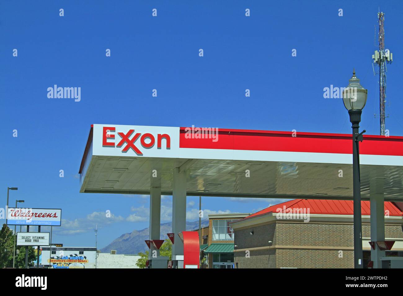 EXXON Gas station advertisement sign with blue sky outdoor Stock Photo
