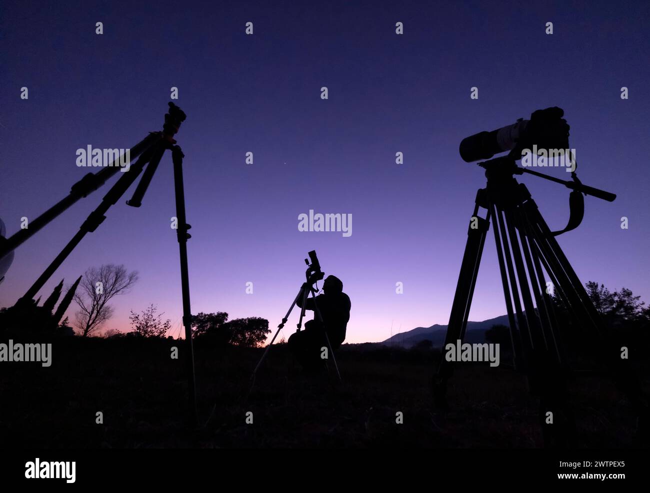Astronomer with a camera photographing night skies Stock Photo Alamy
