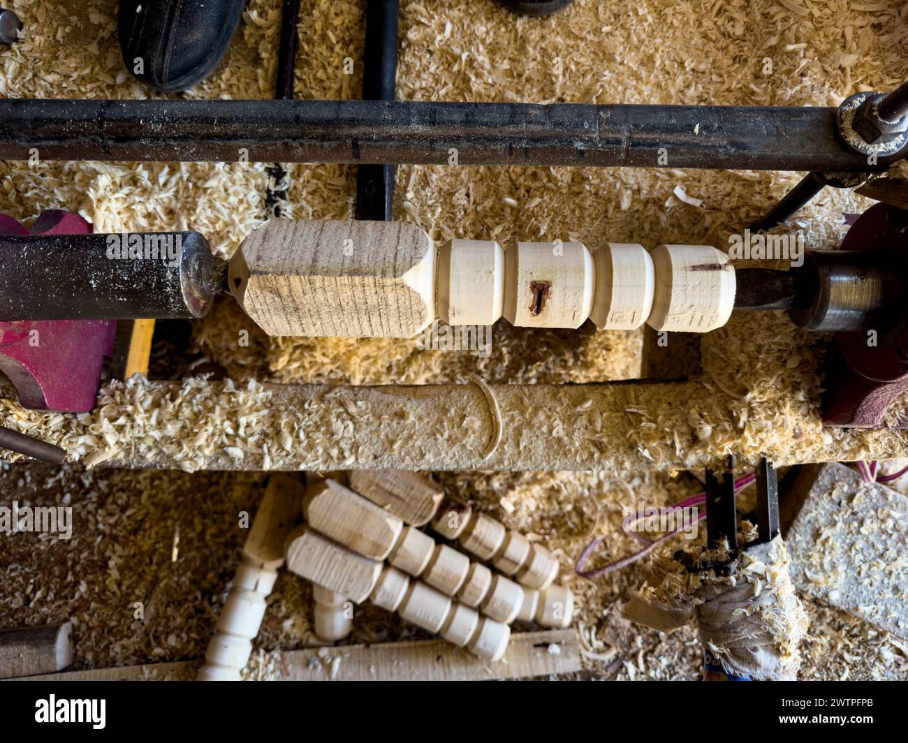 Wood worker turning wood on a lathe Stock Photo