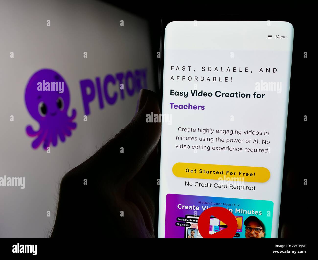 Person holding smartphone with website of US video creation company Pictory Corp. in front of business logo. Focus on center of phone display. Stock Photo
