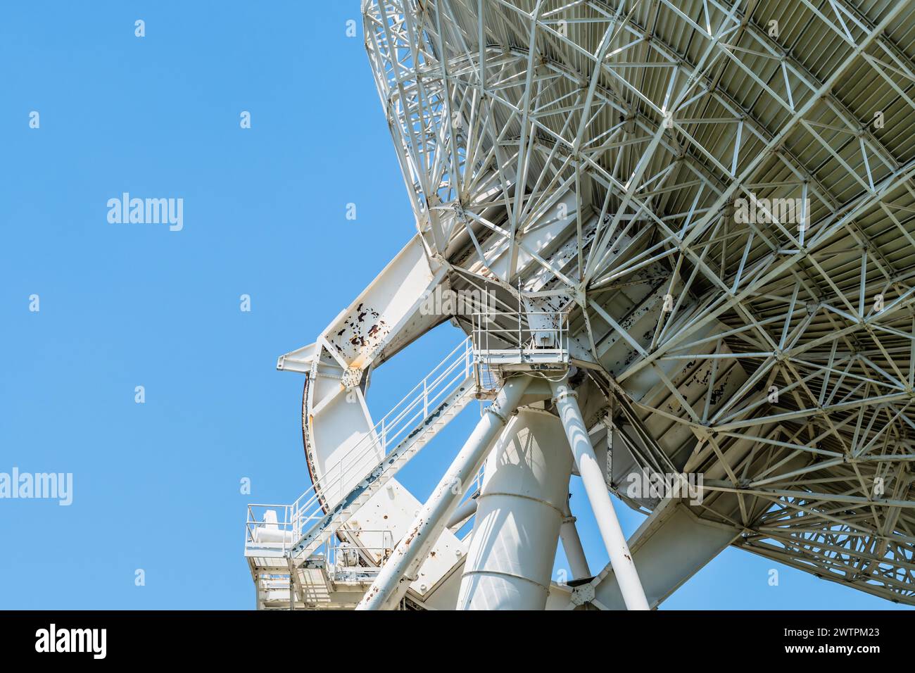 Massive satellite dish dominating the view against a clear sky, in South Korea Stock Photo