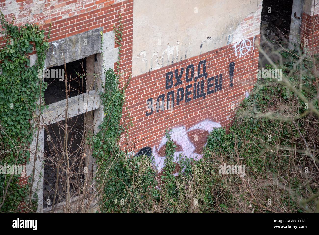 Russian lettering Do not enter on the dilapidated Alpenhaus, Beelitz-Heilstaetten, former lung sanatorium, military hospital of the Soviet army from Stock Photo