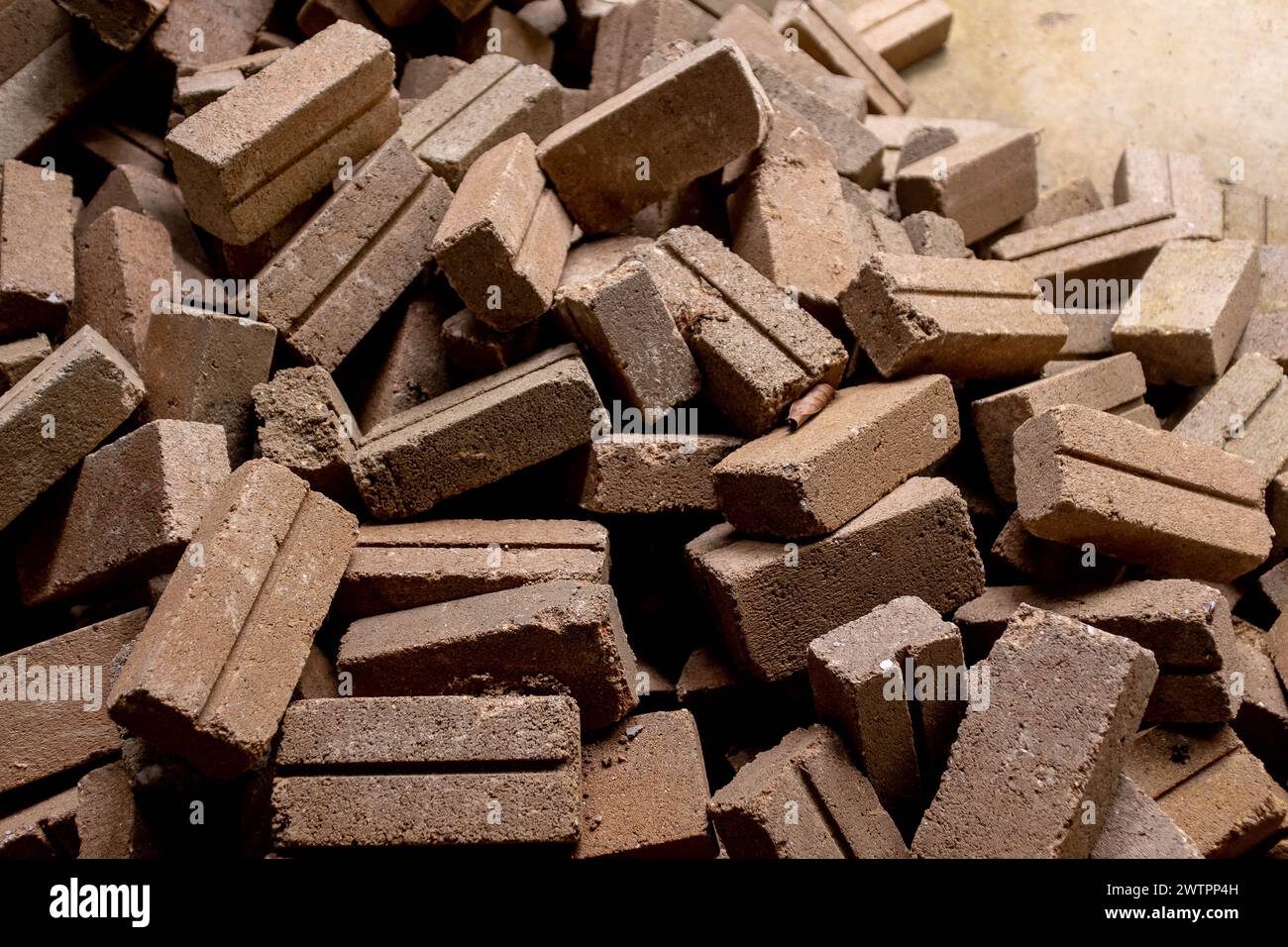 sun dried clay or mud bricks scattered at a work site in Malaysia Stock ...