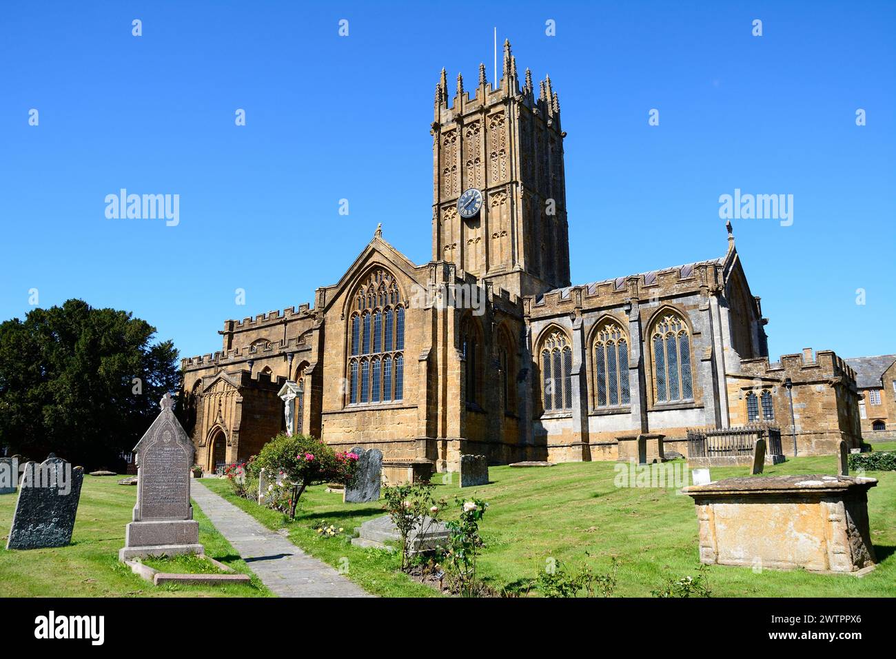 Front view of St Marys Minster Church in the town centre with the graveyard in the foreground, Ilminster, Somerseset, UK, Europe. Stock Photo
