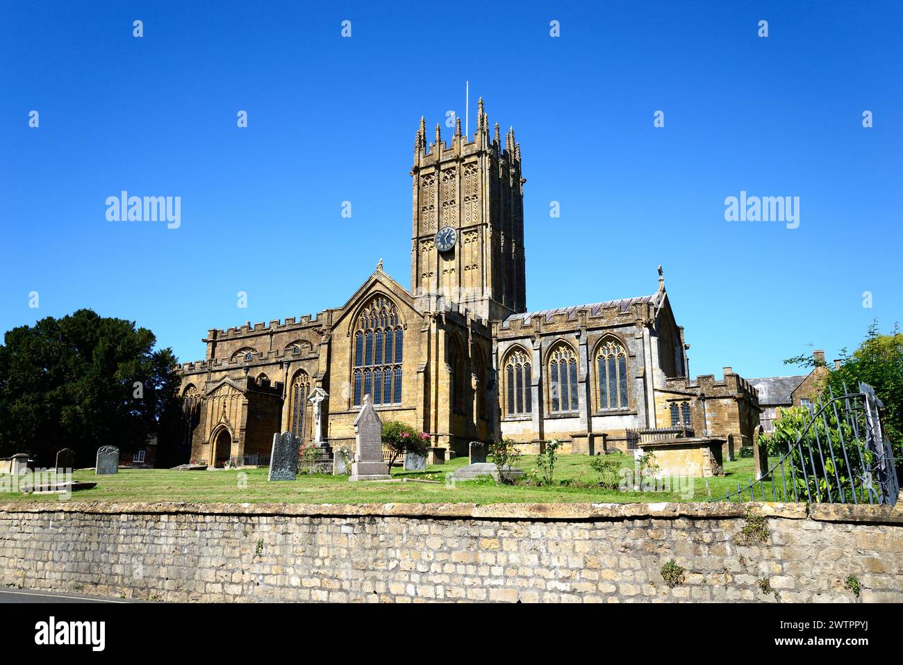 Front view of St Marys Minster Church in the town centre with the graveyard in the foreground, Ilminster, Somerset, UK, Europe. Stock Photo