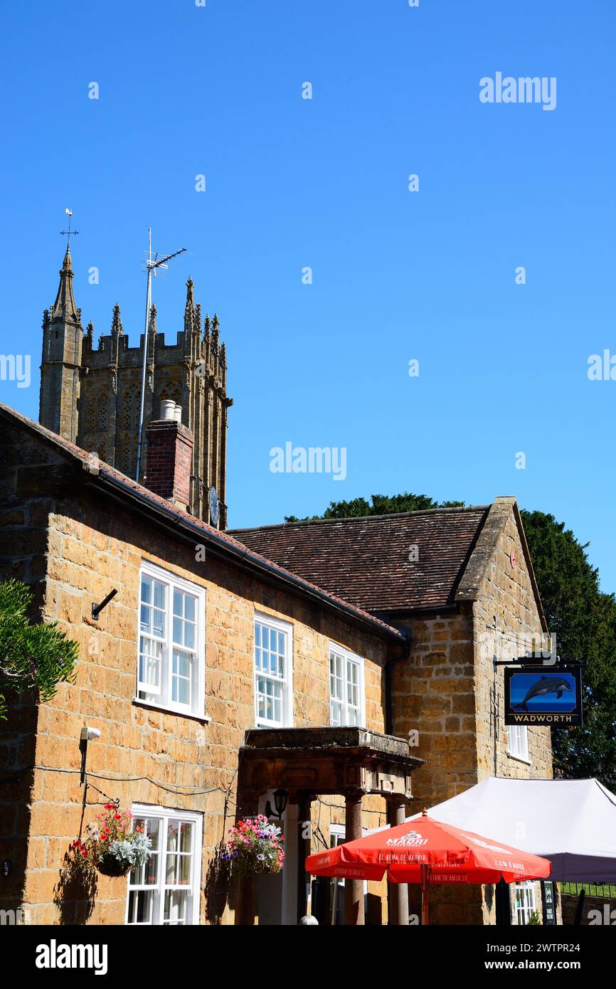 Front view of the Dolphin Inn along Silver Street in the town centre with the top of the minster tower to the rear, Ilminster, Somerset, UK, Europe. Stock Photo