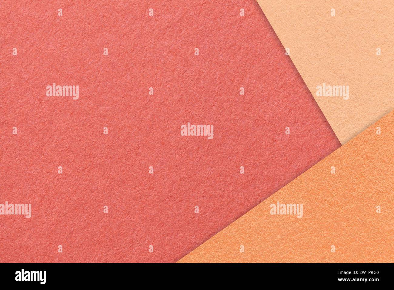 Texture of craft red color paper background with peach fuzz and coral border. Vintage abstract maroon cardboard. Presentation template and mockup with Stock Photo