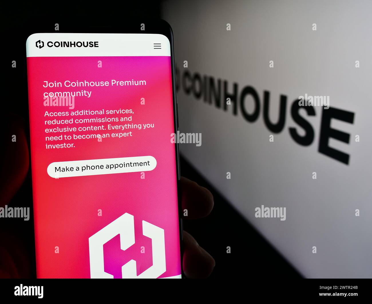 Smartphone with logo of French crypto investment company Coinhouse SAS in  front of business website. Focus on left of phone display Stock Photo -  Alamy