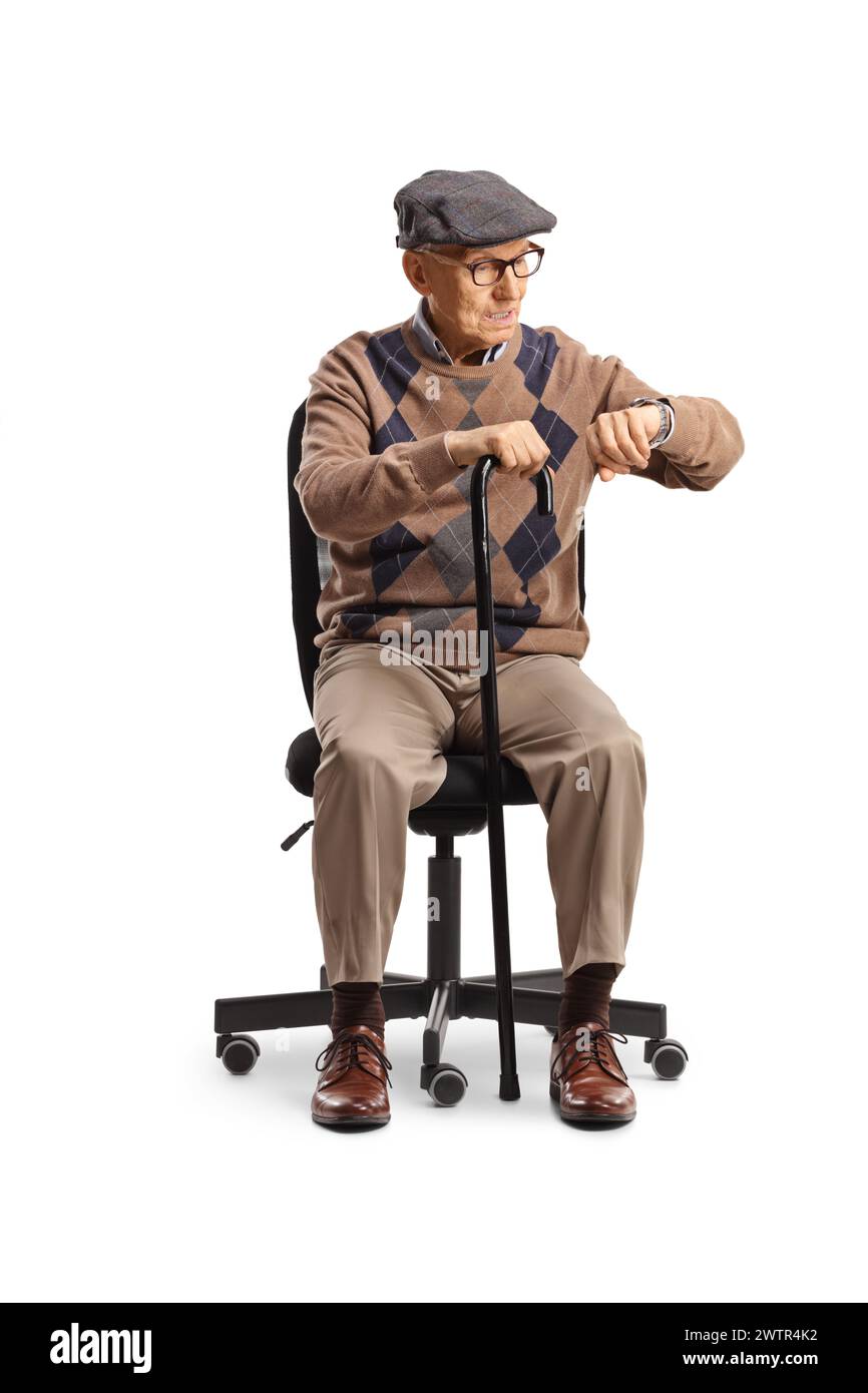 Elderly man sitting in an office chair and checking his watch isolated ...