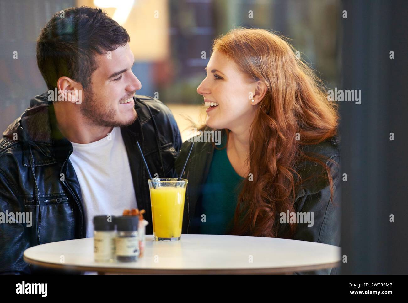 Couple, smile and eye contact in restaurant with love, romance and ...