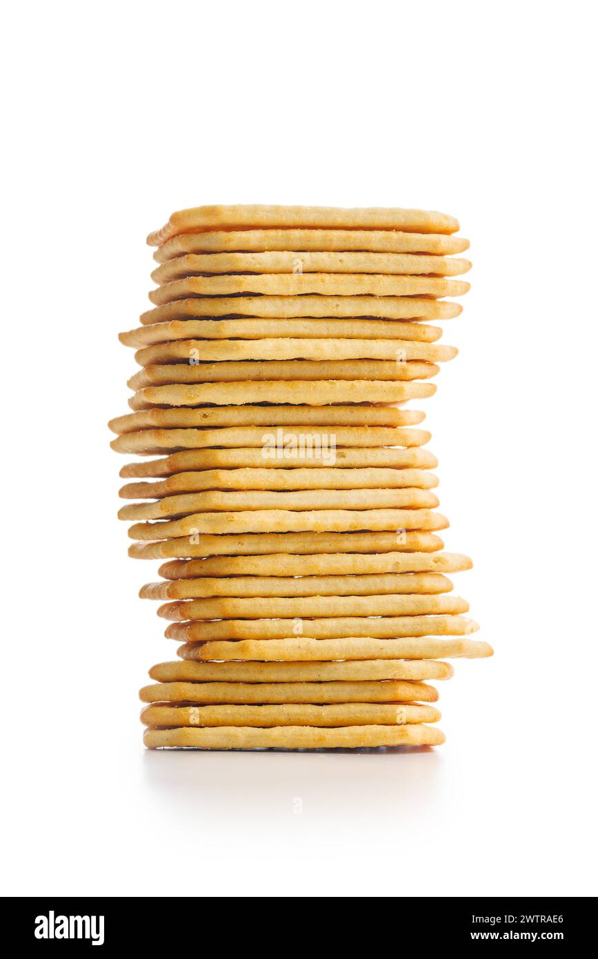 A pile of crackers stacked on a plain white surface. Isolated on white ...
