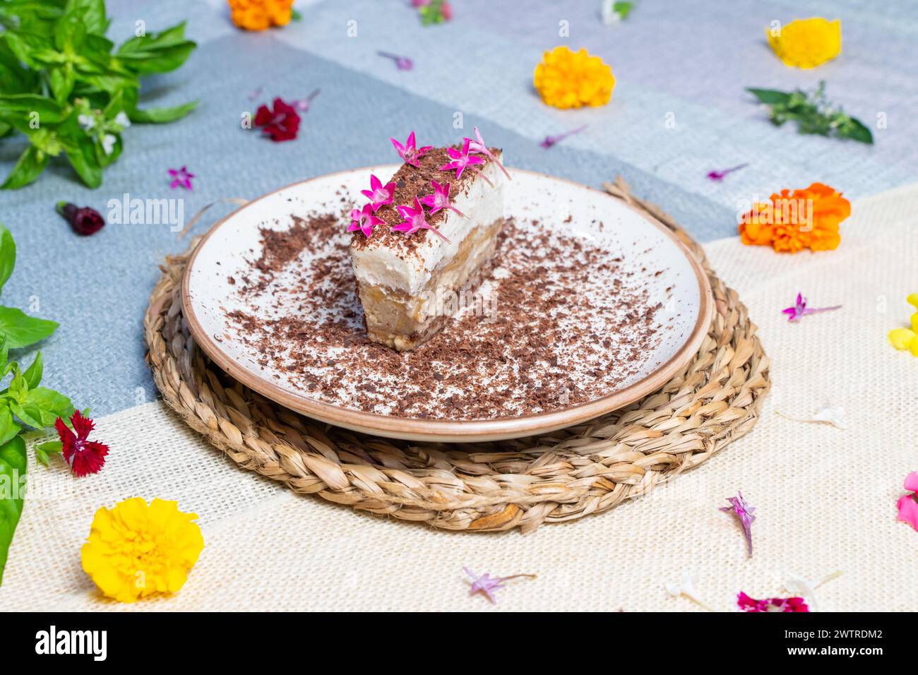 Plate with ice cream cake slices and a decorative flower on top Stock Photo