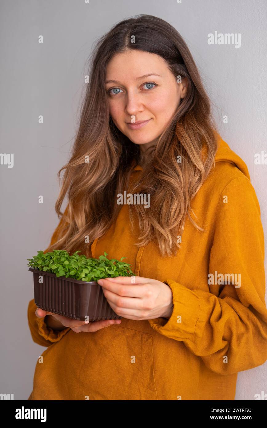 Contented woman in mustard hi-res stock photography and images - Alamy