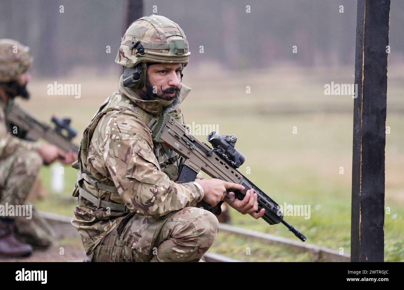 A Sikh soldier of the British Army during a shooting competition during the Holla Mahalla Sikh military festival, at the Aldershot Garrison, Hampshire. The centuries old Hola Mahalla festival celebrates Sikh martial traditions, and promotes courage, preparation, and readiness. Picture date: Tuesday March 19, 2024. Stock Photo