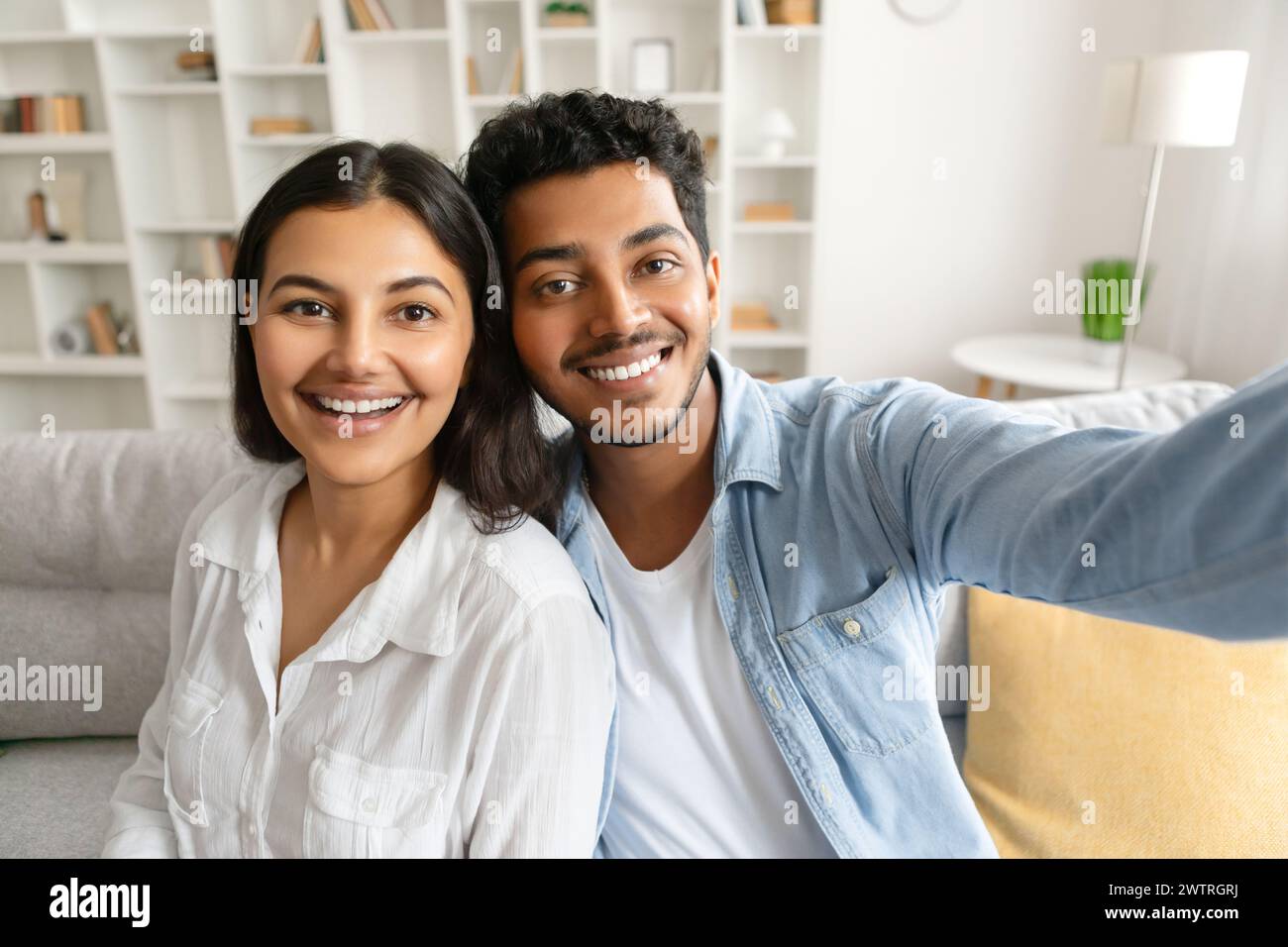 Happy indian couple taking selfie with cheerful expression Stock Photo