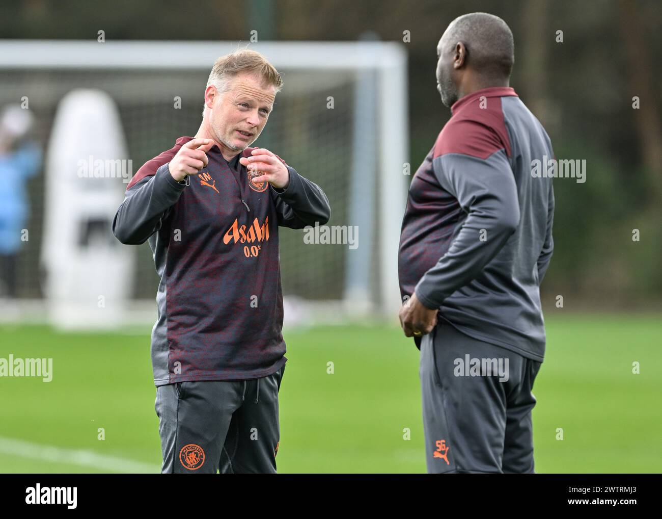 Manchester, UK. 16th Mar, 2024. Alan Mahon Assistant coach of Manchester City Women speaks with fellow coach Shaun Goater, during Manchester City Women Training session at Etihad Campus, Manchester, United Kingdom, 19th March 2024 (Photo by Cody Froggatt/News Images) in Manchester, United Kingdom on 3/16/2024. (Photo by Cody Froggatt/News Images/Sipa USA) Credit: Sipa USA/Alamy Live News Stock Photo