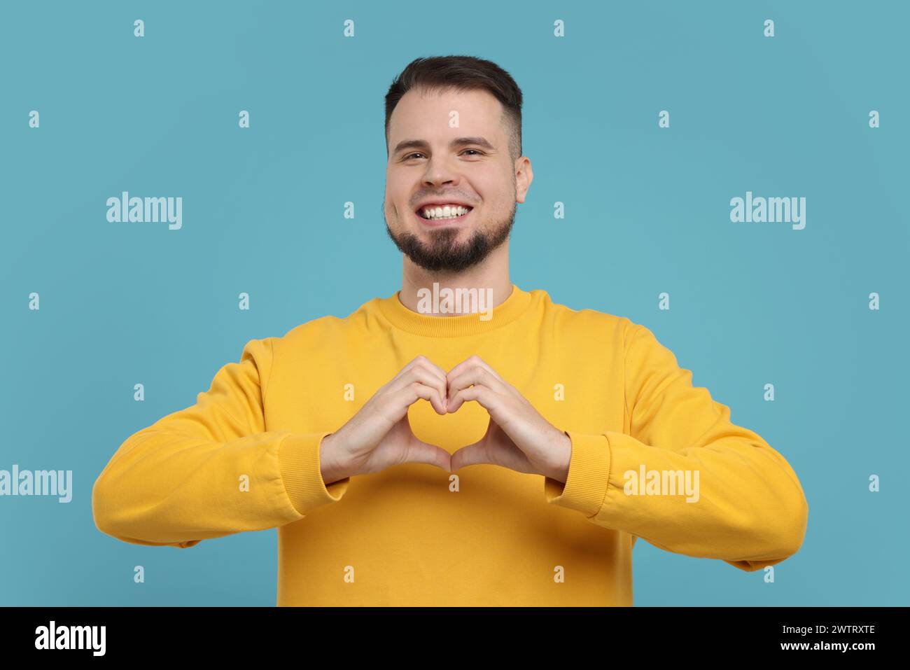 Man showing love sign hands hi-res stock photography and images - Alamy