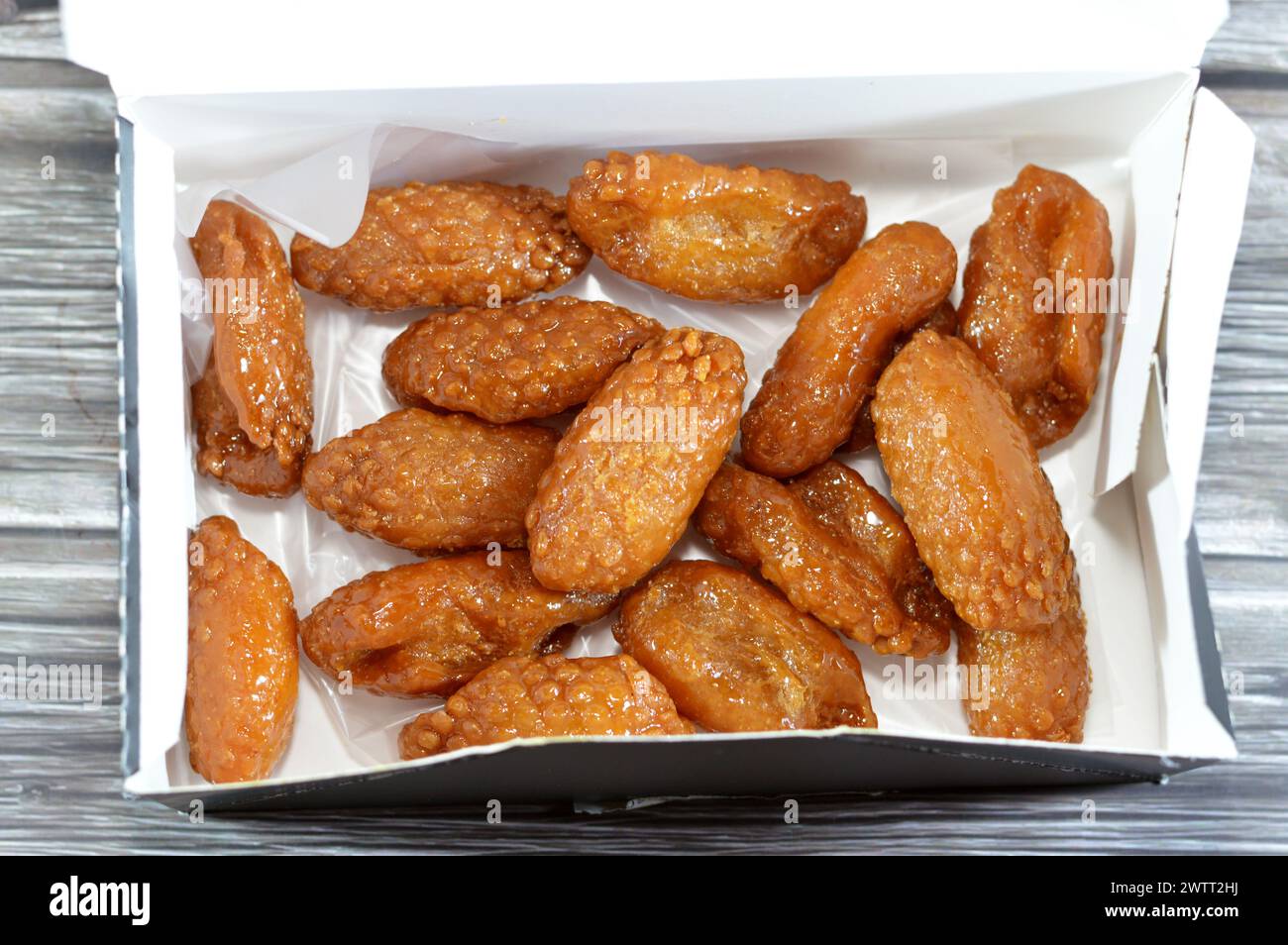 Egyptian Zainab fingers or glazed anise fingers, flour with semolina in the form of fingers that are crunchy on the outside and very soft on the insid Stock Photo