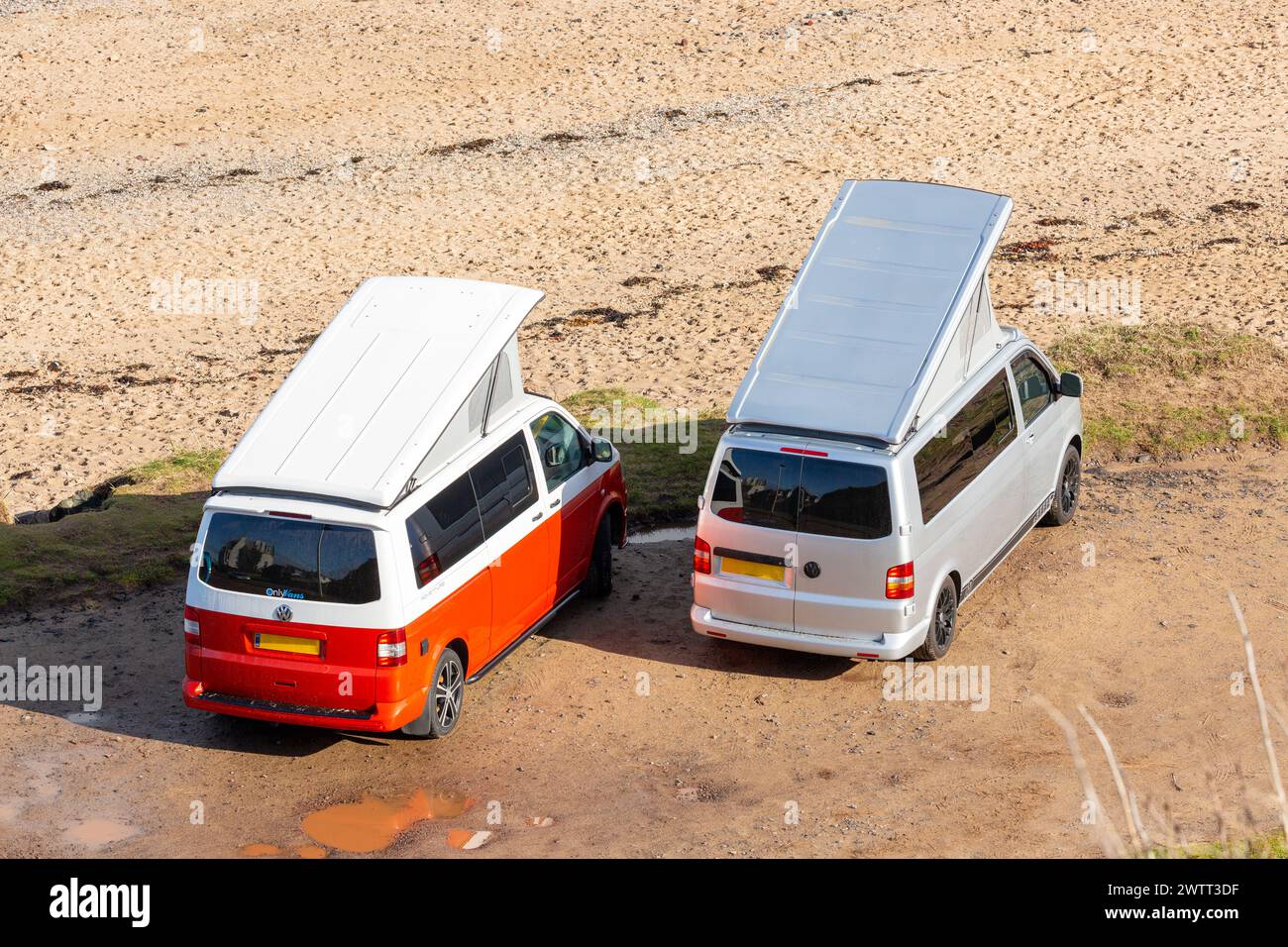 Two VW Campervans parked side by side at the beach in North Berwick. Stock Photo