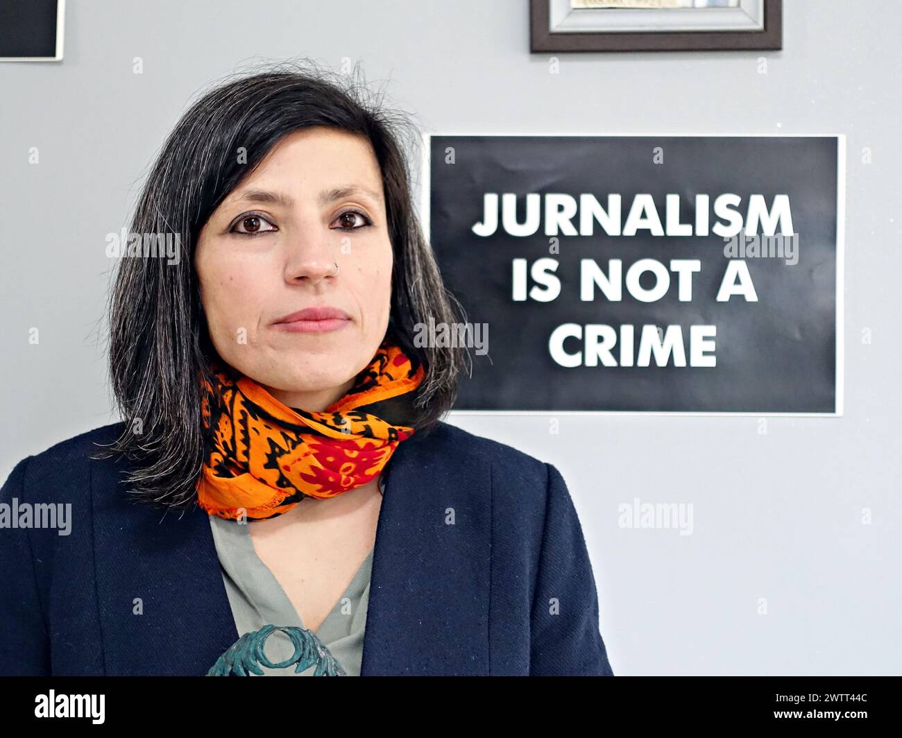 Dicle Muftuoglu, Co-Chairman of the Dicle Firat Journalists Association in Diyarbakir, is seen in front of the inscription 'Journalism is not a crime'. Dicle Muftuoglu who won the Free Press Unlimited's “Most Resilient Journalist Award” in the Netherlands in November last year, but could not receive the award because she was in prison, received her award when she was released. Journalist Muftuoglu, who was held in prison for 10 months on the grounds that she was a member of the armed Kurdish organization Kurdistan Workers' Party (PKK), was released last week. The majority of the members of th Stock Photo