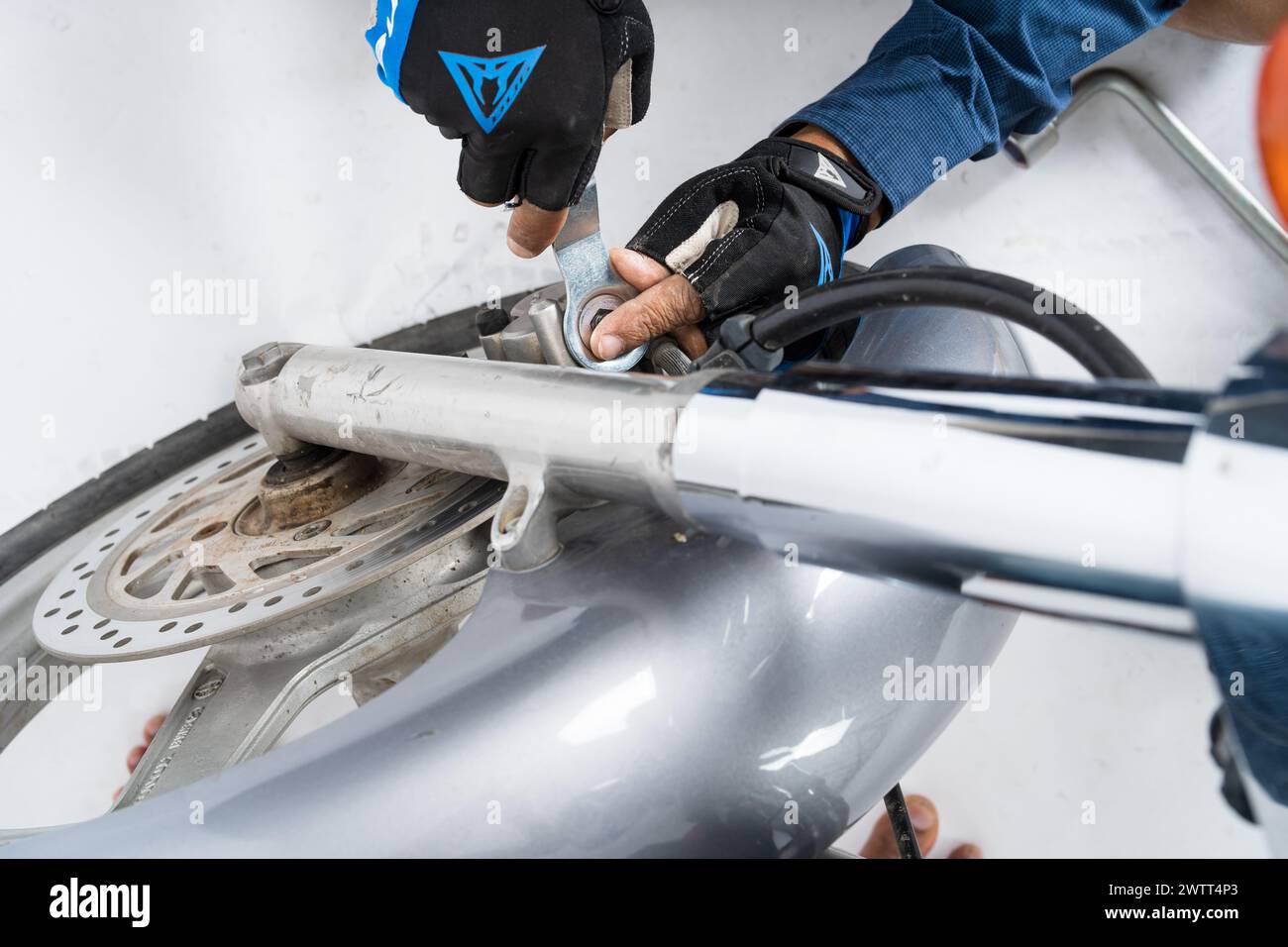 Motorbike Mechanic, People are repairing a motorcycle Use a wrench and ...