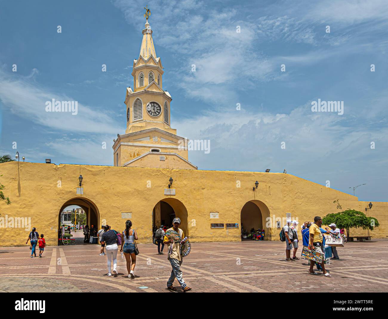 Cartagena, Colombia - July 25, 2023: Torre del Reloj and gate in remaining part of ramparts into old town center seen from Plaza de los Coches under b Stock Photo