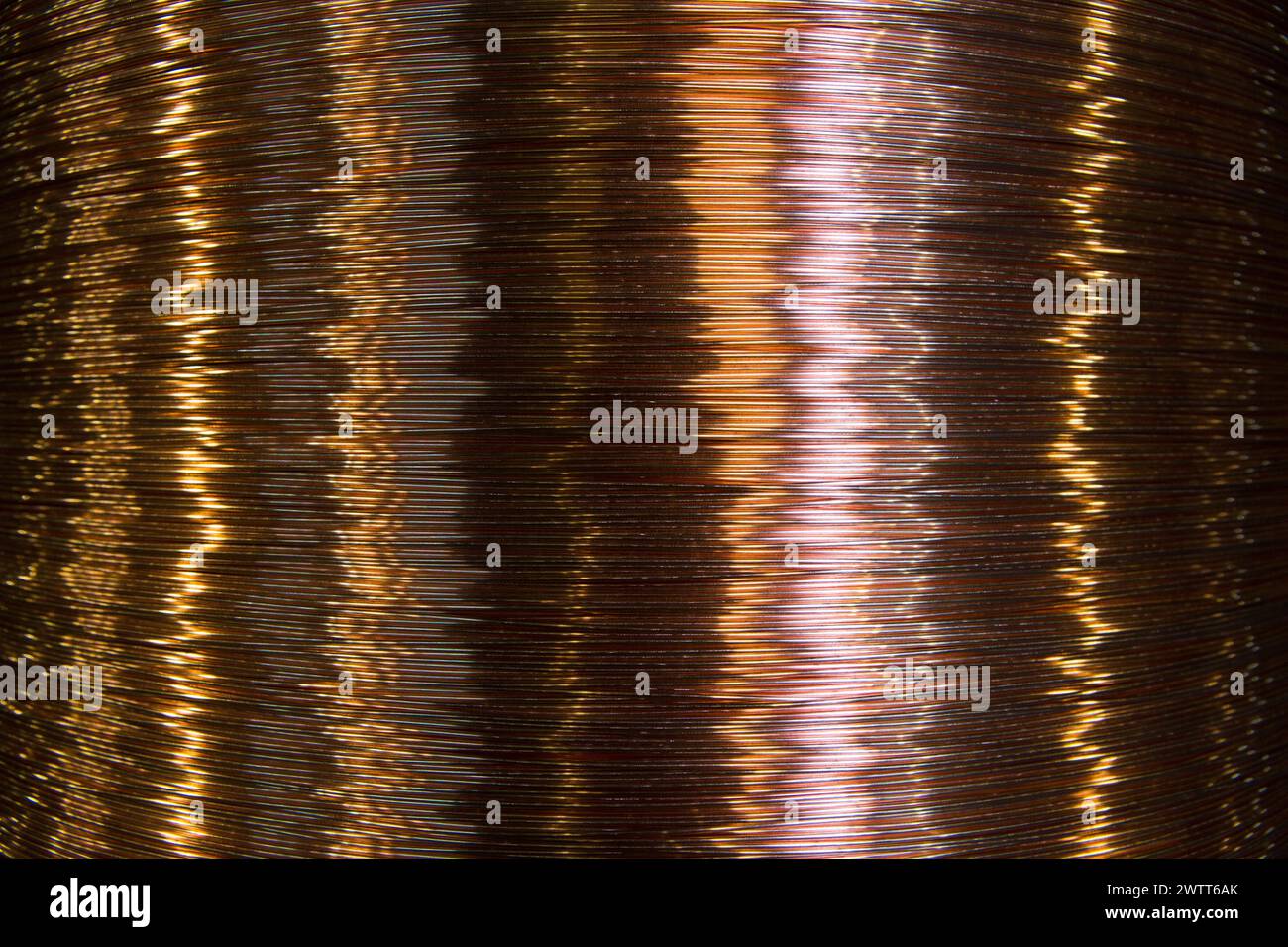 Large reels of copper wire at an industrial manufacturing plant. Stock Photo