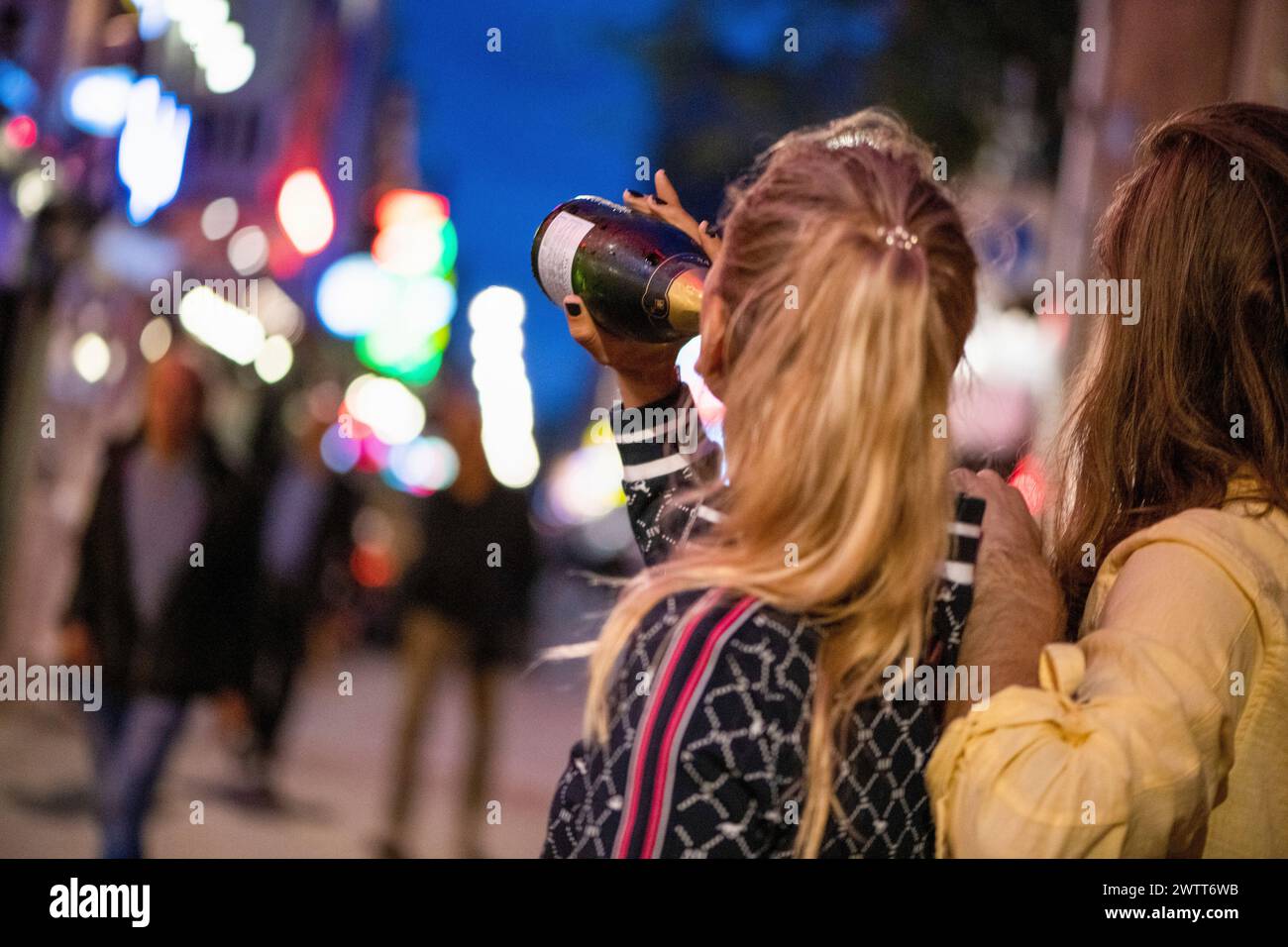 Friends enjoying a night out in the city. Stock Photo