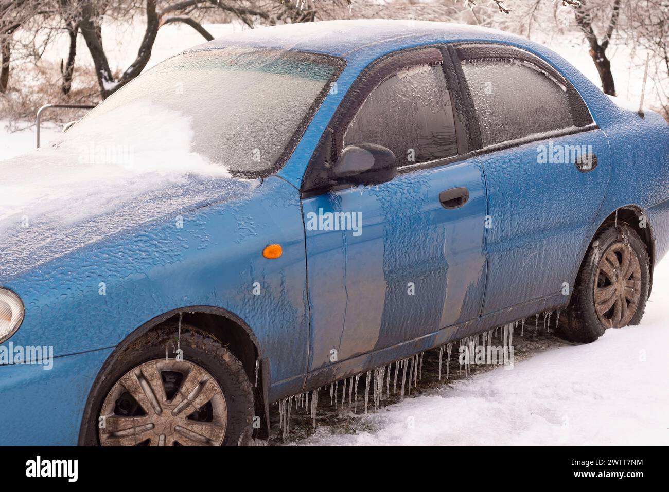 frozen car on a winter morning in ice. Stock Photo
