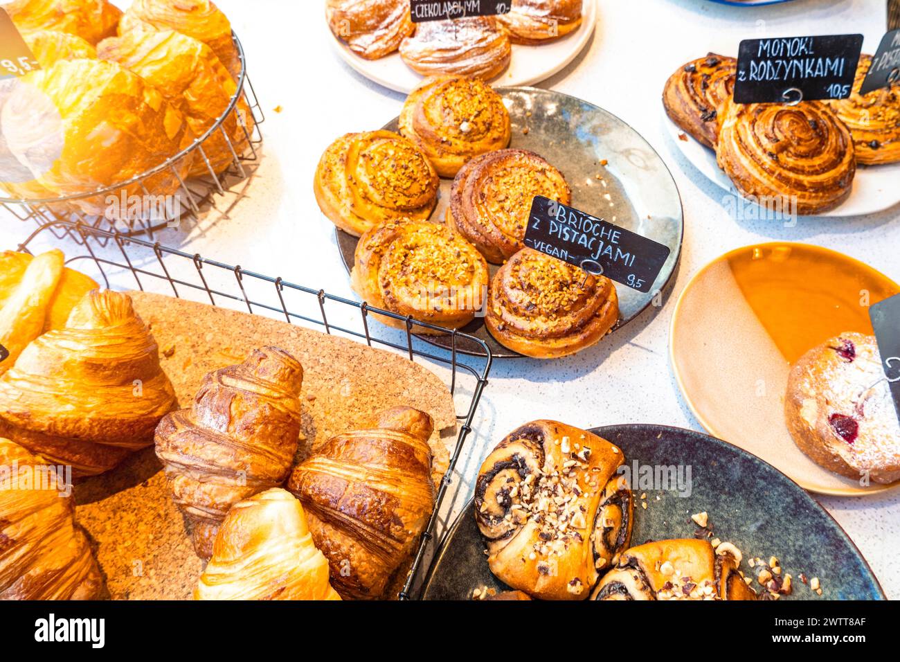 Assorted pastries on display at a cozy bakery Stock Photo