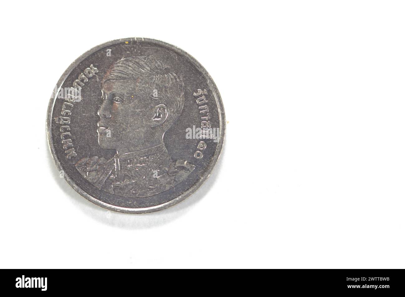 Obverse side of 1 one Baht Thai coin features Bust facing left of Maha Vajiralongkorn Rama X, 1 Baht - Rama X 1st portrait, 1 THB years 2561-2566 (201 Stock Photo