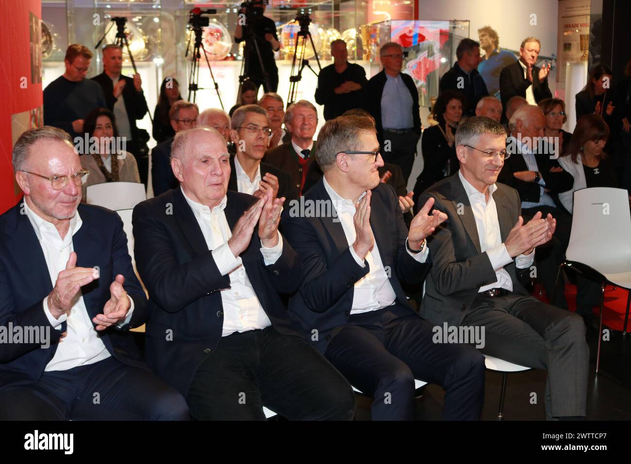 MUNICH, Germany - 19. MARCH 2024: Sepp MAIER, former professional footballer, goalkeeper, celebrated with friends and family and the FcBayern Management his 80th birthday (28th of February) whilst the opening of a special and attractive Exhibition on March 19th at Allianz Arena. Karl-Heinz Rummenigge, FC Bayern München Honorary President Uli Hoeness, Jan-Christian Dreesen, CEO of FC Bayern München, Herbert Hainer, President of FC bayern München, Fc Bayern Muenchen created a Sepp MAIER exhibition in the Museum Pavillion at the Allianz Arena in Munich and attended the grand opening. Football Stock Photo