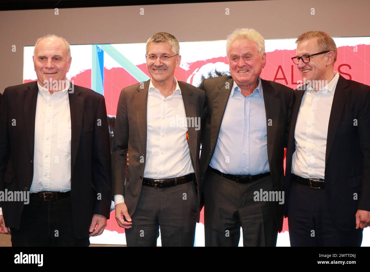 MUNICH, Germany - 19. MARCH 2024: FC Bayern München Honorary President Uli Hoeness, Herbert Hainer, President of FC bayern München, Sepp MAIER and Jan-Christian Dreesen, CEO of FC Bayern München - Sepp MAIER, former professional footballer, goalkeeper, celebrated with friends and family and the FcBayern Management his 80th birthday (28th of February) whilst the opening of a special and attractive Exhibition on March 19th at Allianz Arena. Fc Bayern Muenchen created a Sepp MAIER exhibition in the Museum Pavillion at the Allianz Arena in Munich and attended the grand opening. Football keeper S Stock Photo