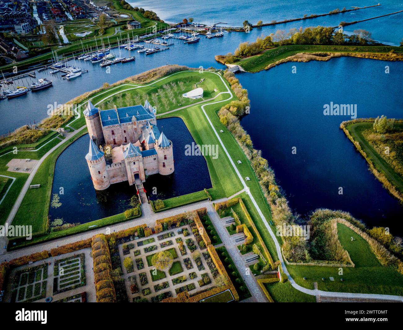 Aerial view of a majestic castle surrounded by water Stock Photo - Alamy