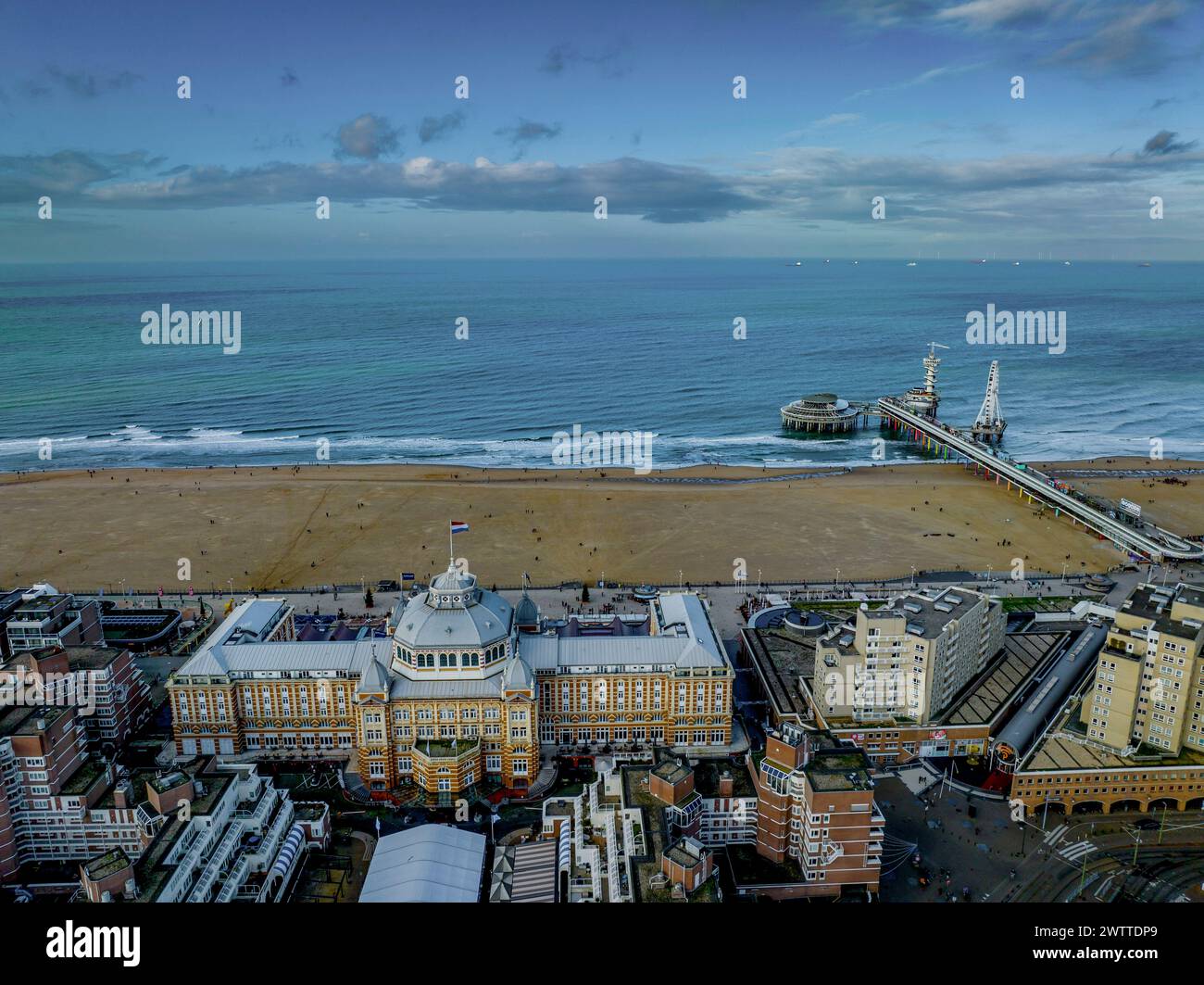 Aerial view of a vibrant coastal cityscape at dusk Stock Photo - Alamy