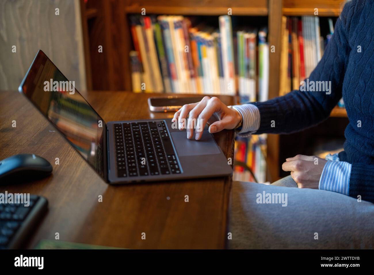 A person taking a photography class online with a teacher