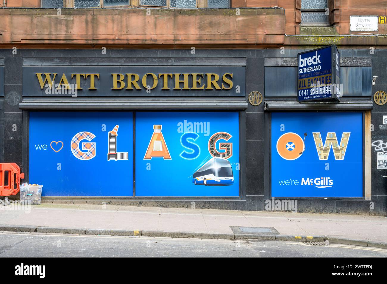 McGill's Bus Company advertising on the window of the former Watt Brothers Department store, Bath Street, Glasgow, Scotland, UK, Europe Stock Photo