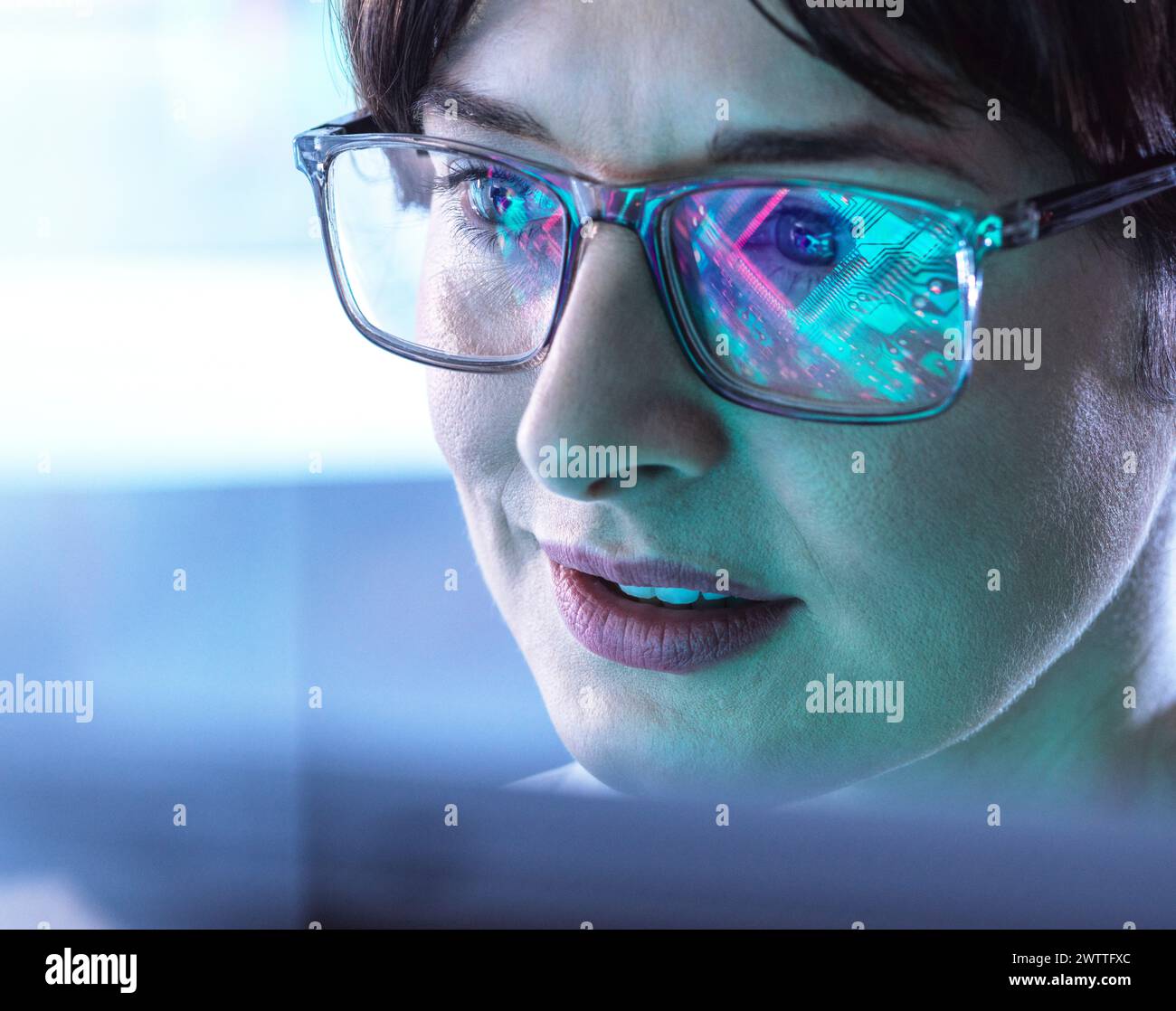 AI Engineering, Female STEM engineer using artificial intelligence to design micro electronics in the lab. Stock Photo