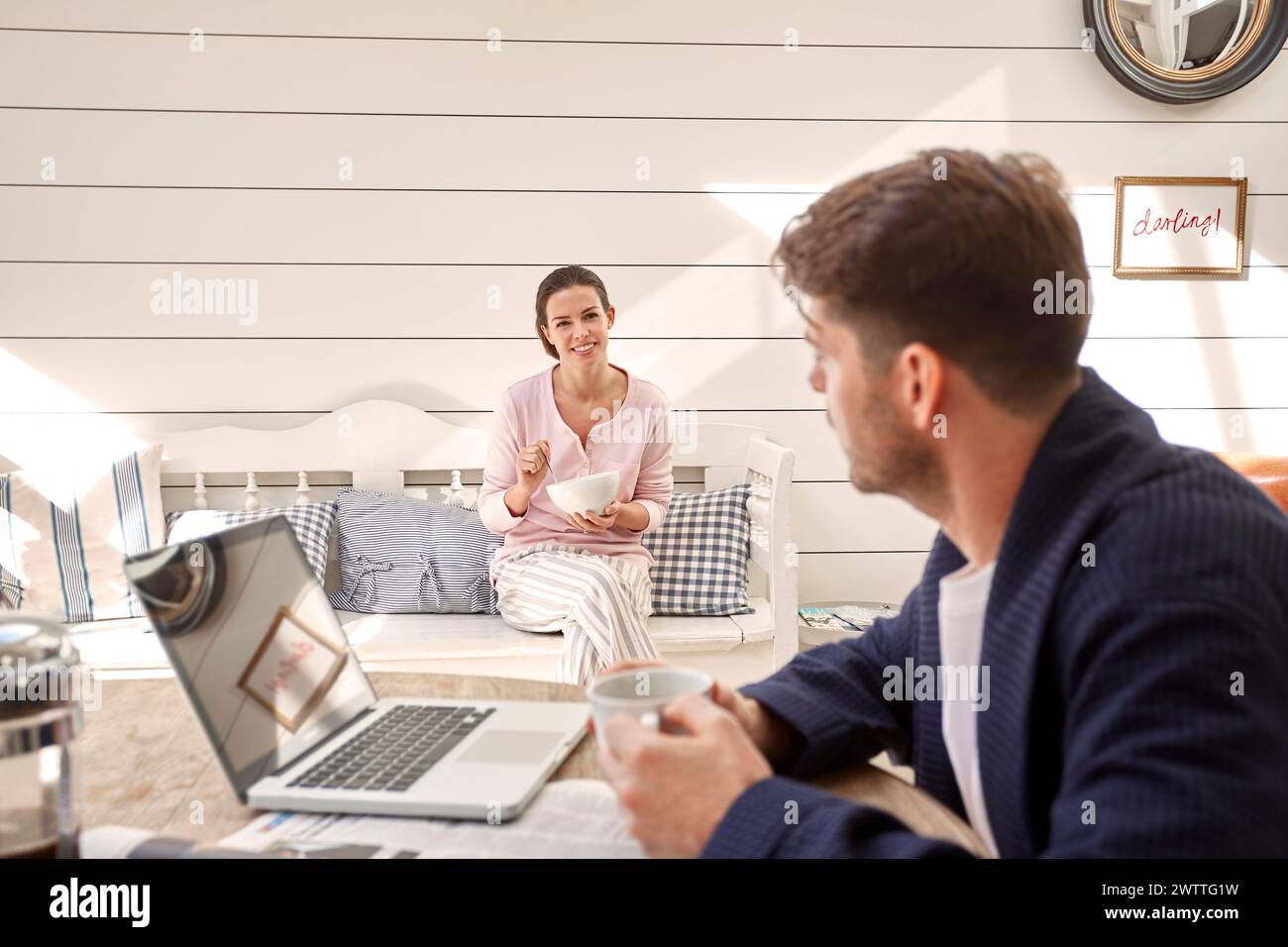 Man and woman in a cozy home conversation Stock Photo