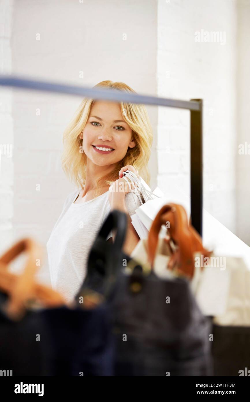 Woman smiling in a clothing store Stock Photo