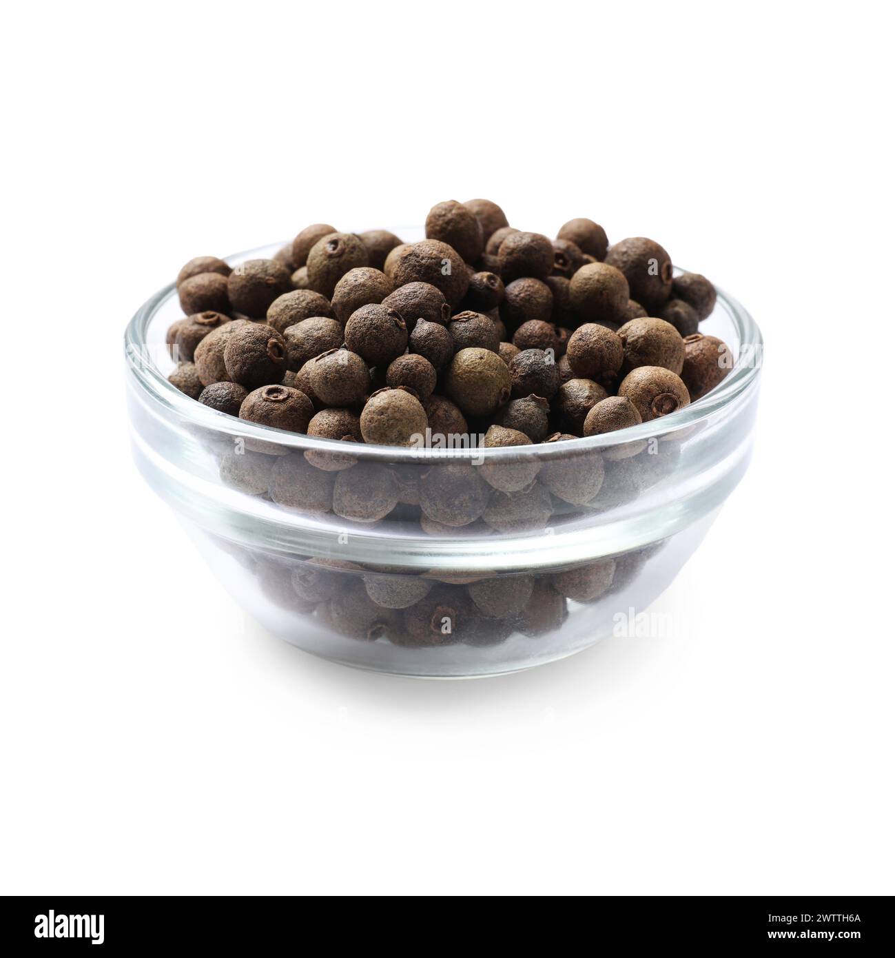 Dry allspice berries (Jamaica pepper) in bowl isolated on white Stock